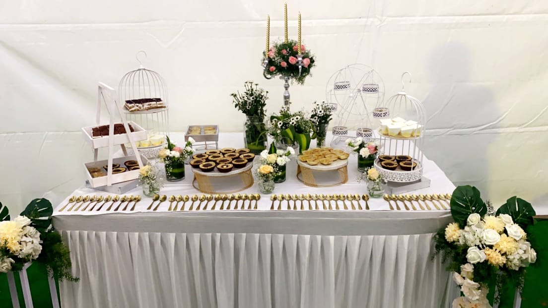 A complete floral dessert buffet setup